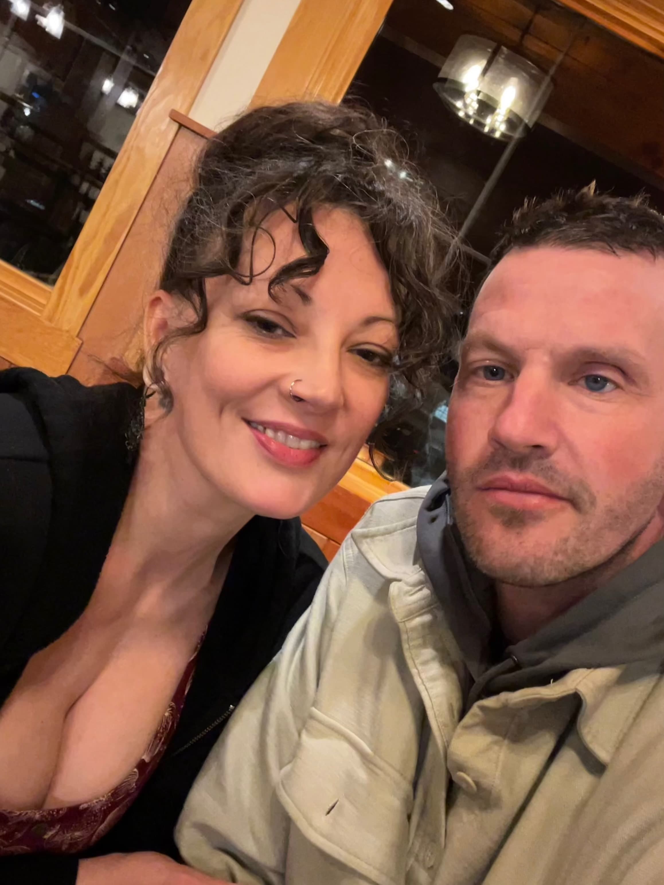 Heidi and Jon together at a candlelit table
